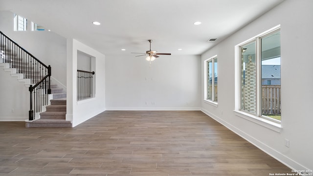 interior space featuring light wood-type flooring, a wealth of natural light, and ceiling fan