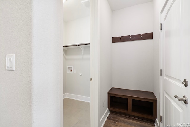 laundry room with washer hookup and dark wood-type flooring