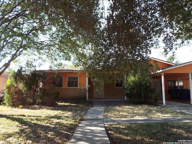 view of front of home featuring a carport