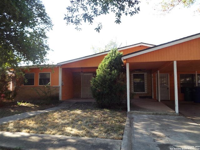 view of front of home featuring a carport