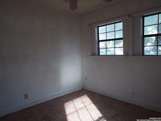 unfurnished room with ceiling fan