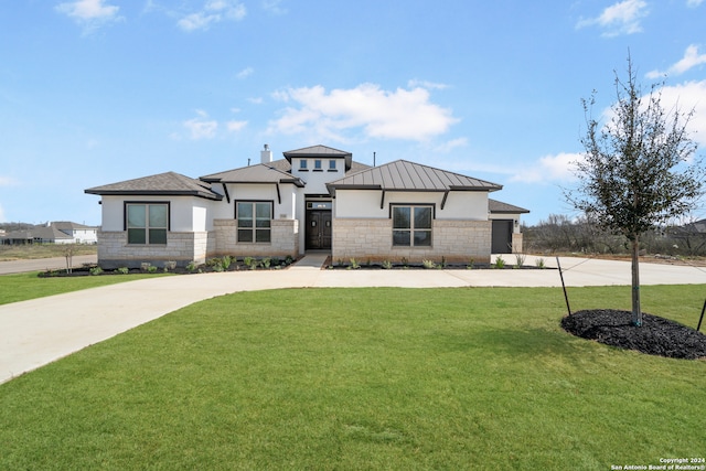 prairie-style home with a front lawn