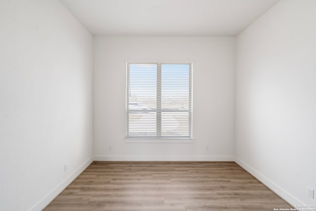 spare room featuring light wood-type flooring