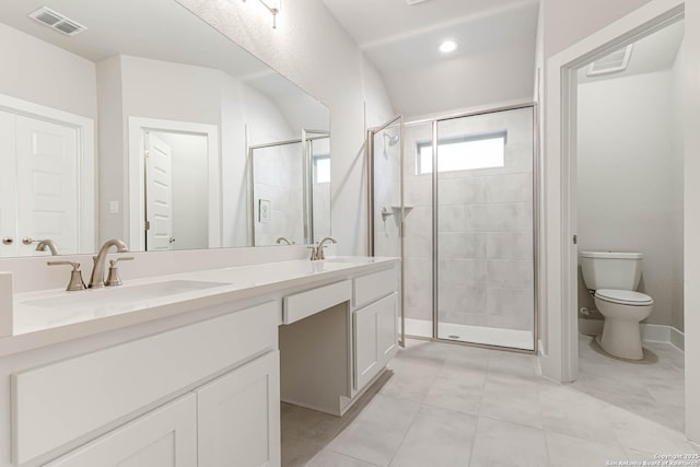 bathroom with walk in shower, vanity, toilet, and tile patterned flooring