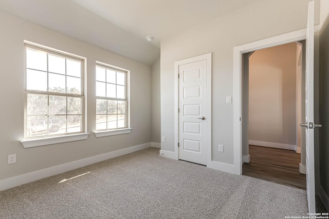 unfurnished bedroom with carpet flooring