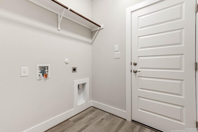 washroom featuring electric dryer hookup, washer hookup, gas dryer hookup, and light wood-type flooring