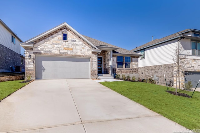 view of front of property featuring cooling unit, a garage, and a front yard