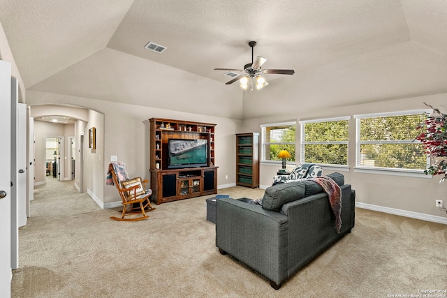 carpeted living room with ceiling fan, a textured ceiling, and vaulted ceiling