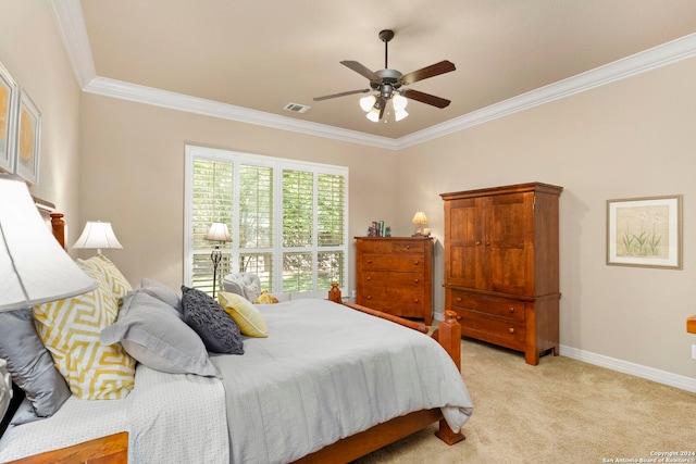 carpeted bedroom featuring crown molding and ceiling fan