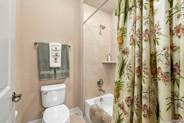 bathroom featuring toilet and shower / bath combo