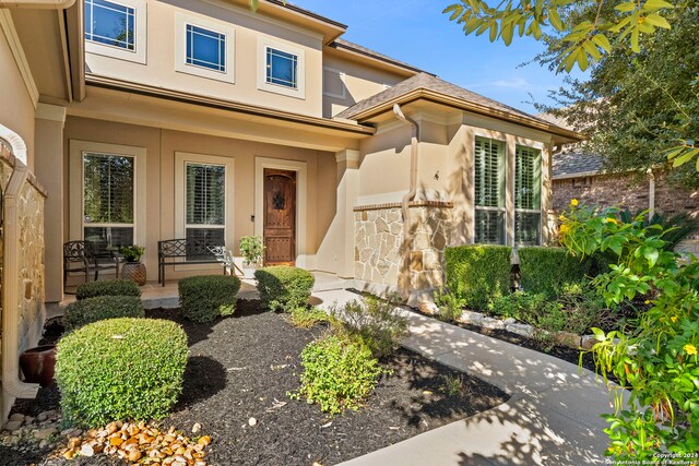 doorway to property with stucco siding