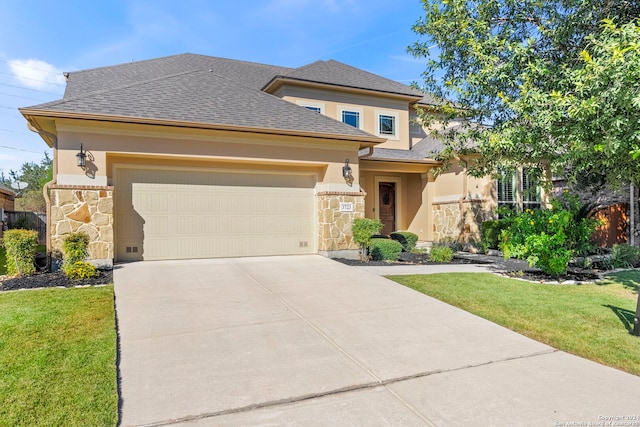 prairie-style house featuring a front lawn and a garage