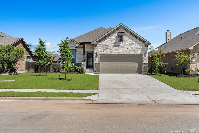 view of front facade with a garage and a front lawn