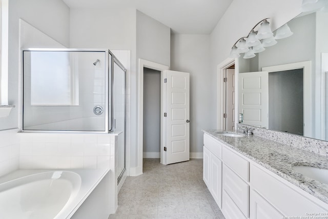 bathroom featuring tile patterned flooring, separate shower and tub, and vanity