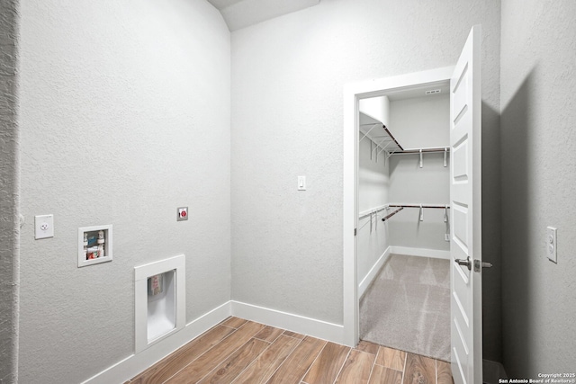 laundry area featuring electric dryer hookup and washer hookup