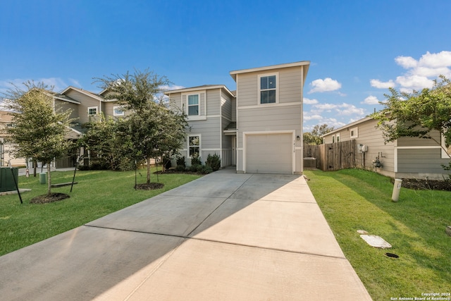 view of front of house featuring a front yard and a garage