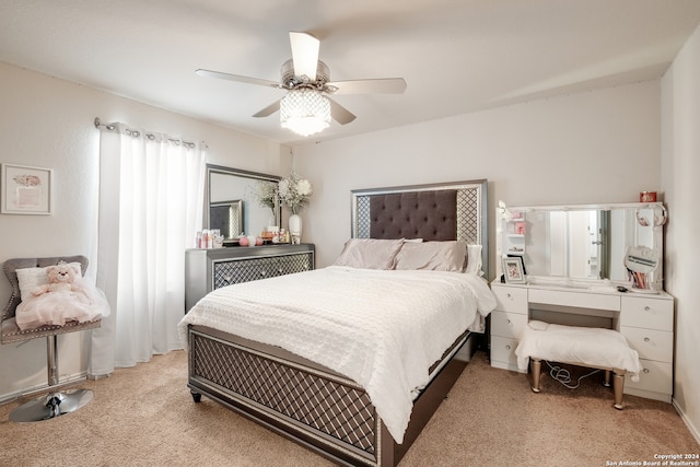 bedroom with light carpet and ceiling fan