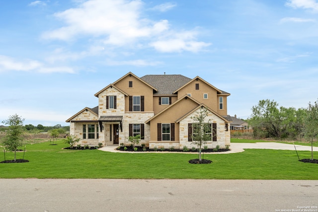 craftsman-style house featuring a front lawn