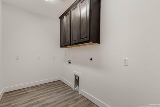 laundry area with hookup for a washing machine, light wood-type flooring, cabinets, and hookup for an electric dryer