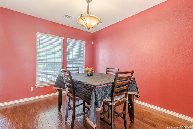 dining area featuring wood-type flooring