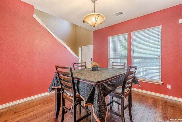 dining area featuring wood-type flooring