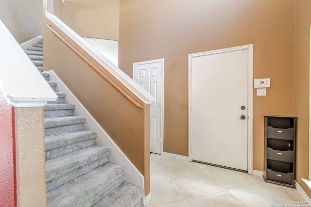 foyer with light tile patterned floors