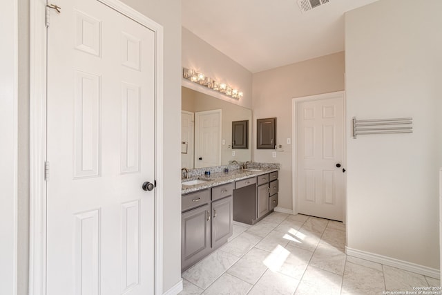 bathroom with tile patterned flooring and vanity