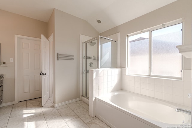 bathroom with a healthy amount of sunlight, vanity, vaulted ceiling, and shower with separate bathtub