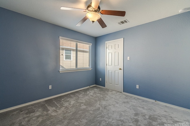 empty room with carpet floors and ceiling fan