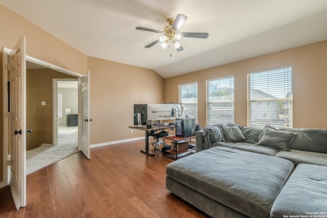 living room featuring wood-type flooring, vaulted ceiling, and ceiling fan