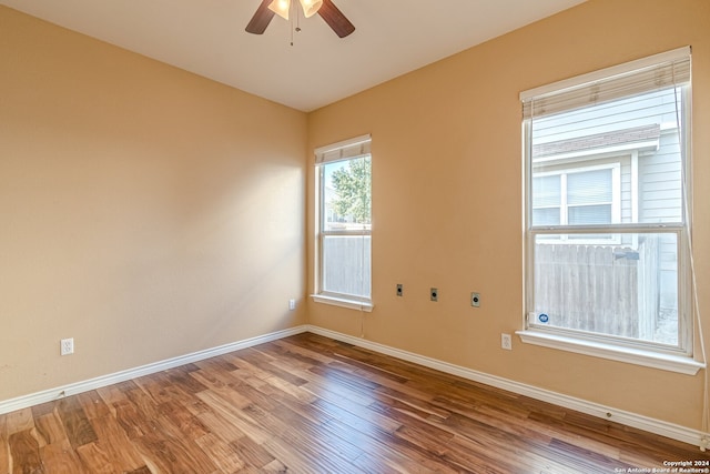 unfurnished room featuring hardwood / wood-style flooring and ceiling fan