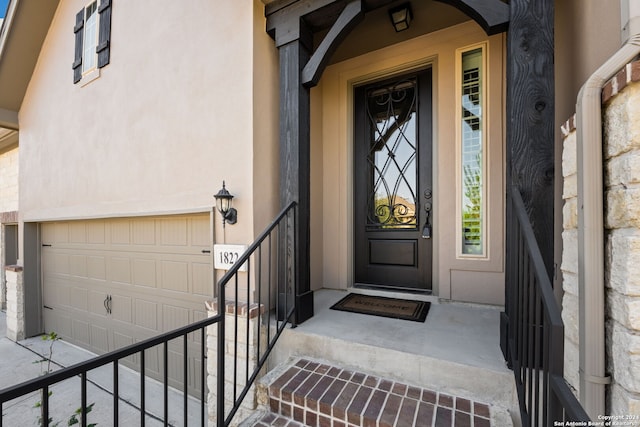 property entrance with a garage