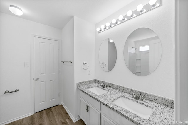 bathroom featuring vanity and hardwood / wood-style floors