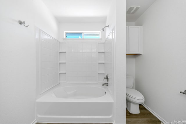 bathroom featuring wood-type flooring,  shower combination, and toilet