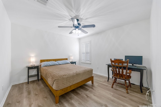 bedroom with ceiling fan and light hardwood / wood-style flooring