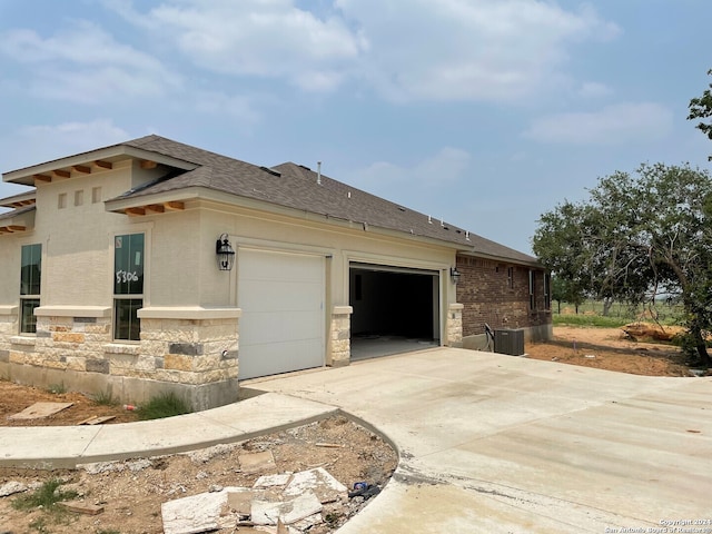 view of side of property with a garage