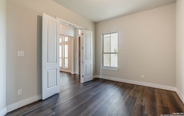 empty room featuring dark hardwood / wood-style floors