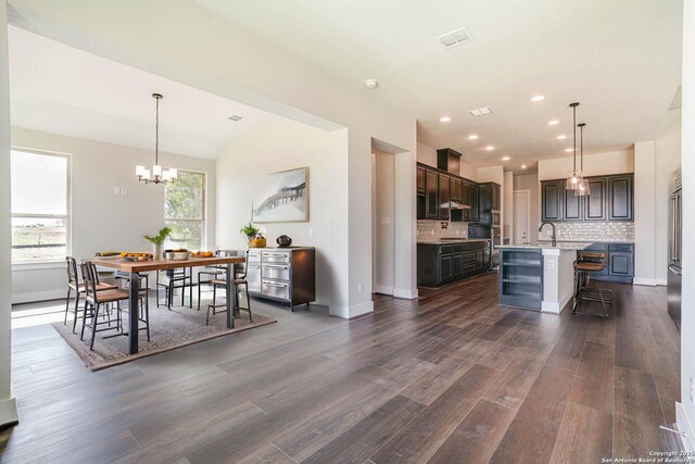 5306 Estates Oak Way, San Antonio, TX 78263 - unfurnished living room featuring dark wood-type flooring, ceiling fan, beamed ceiling, and a fireplace