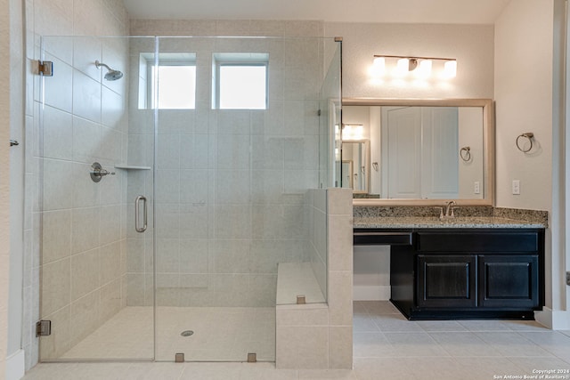 bathroom with vanity, tile patterned floors, and an enclosed shower