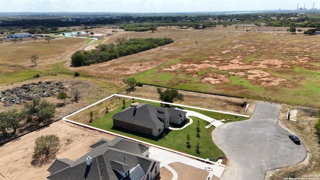 birds eye view of property with a rural view