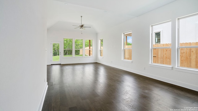 empty room with ceiling fan, dark hardwood / wood-style flooring, and lofted ceiling