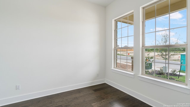 empty room featuring dark wood-type flooring