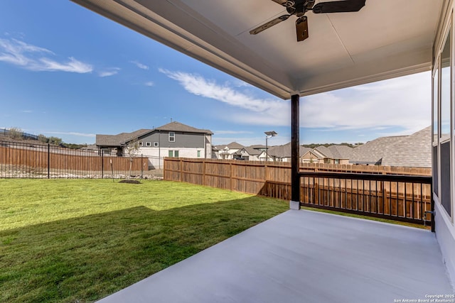 view of yard with ceiling fan and a patio area