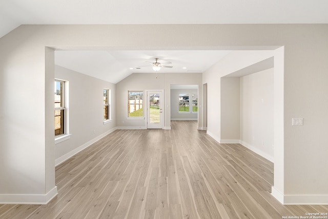 unfurnished living room featuring light hardwood / wood-style flooring, lofted ceiling, and ceiling fan