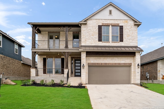 view of front of house featuring a front lawn, a balcony, and a garage