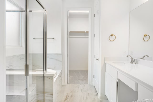 bathroom featuring walk in shower and vanity