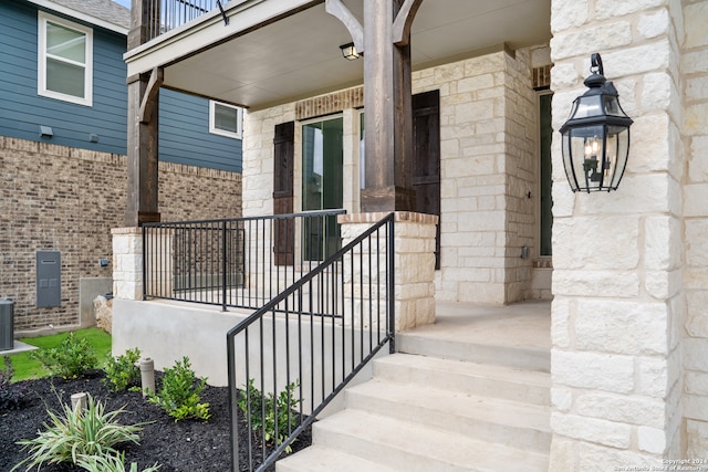 entrance to property featuring cooling unit