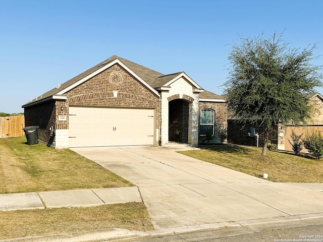 280 Crysanthemum, New Braunfels, TX 78130 - view of front facade featuring fence, a front lawn, brick siding, a garage, and concrete driveway