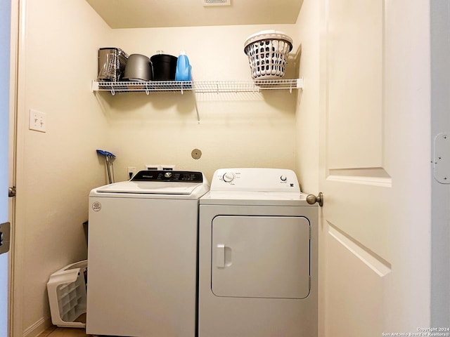 washroom featuring washer and dryer