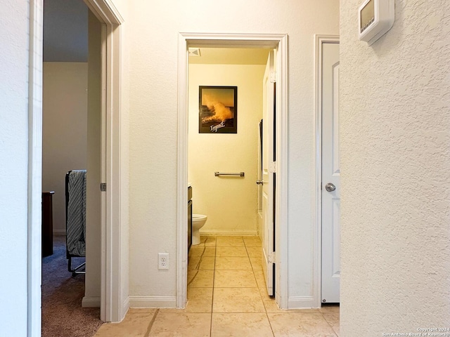 hallway featuring light tile patterned floors